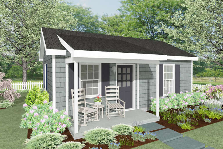 A gray cottage tiny home with white trim and dark gray shutters.