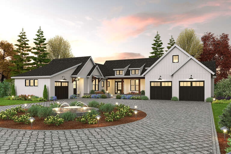 A white modern farmhouse style home that has an in-law suite attached to it. 