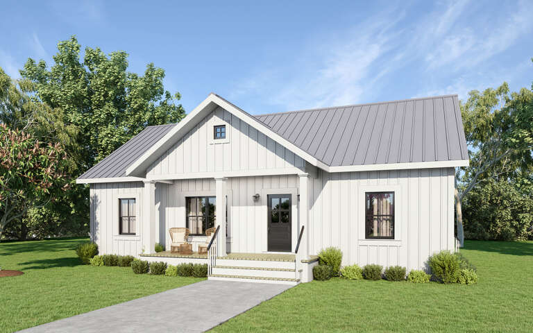 A white ranch-style house with a small front porch, and a driveway.