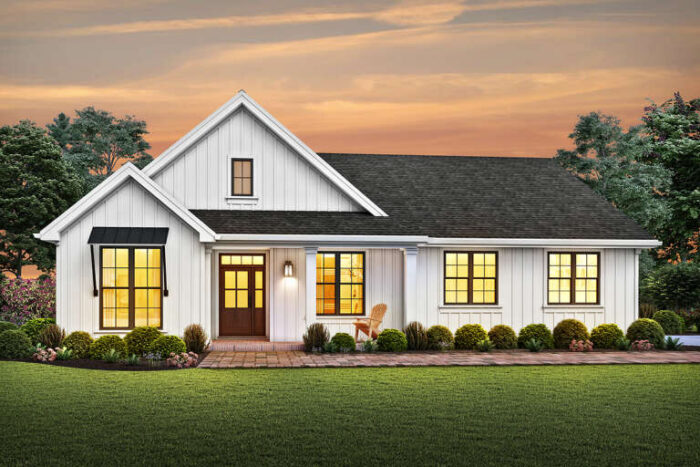 A white ranch style home with a small front porch.