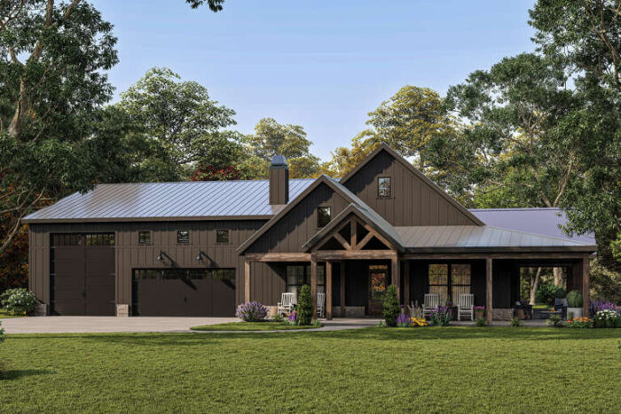 A brown barndominium house with natural wood trim, two car garage & an additional RV garage space.