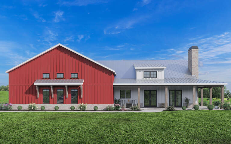 A shouse with a red barn on the left attached to white living space on the right. 