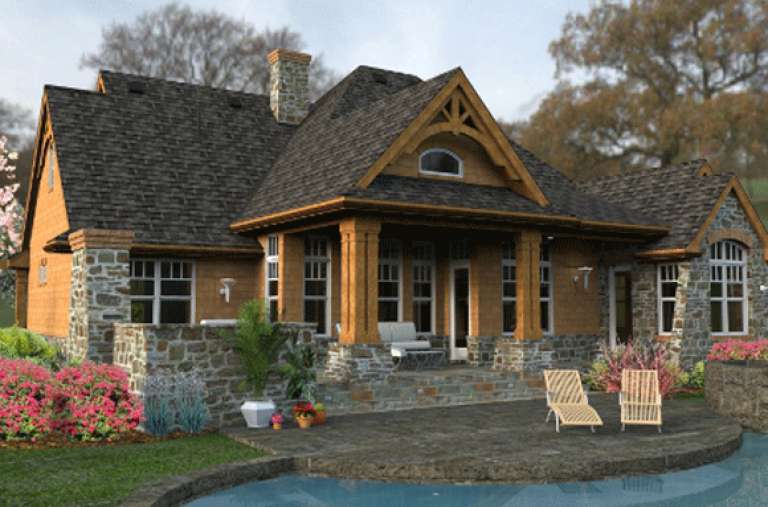 The backyard of a modern Tudor house with a stone patio and pool.