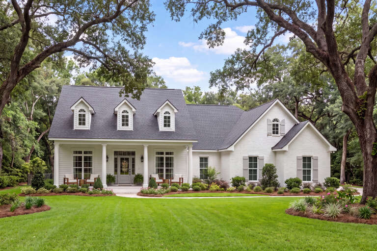 White Country, Angled Front Elevation, painted brick, lap siding, dormers, porch columns, shutters, and lush landscaping. House Plan # 041-00007 Digital Rendering by America's Best House Plans, Inc.