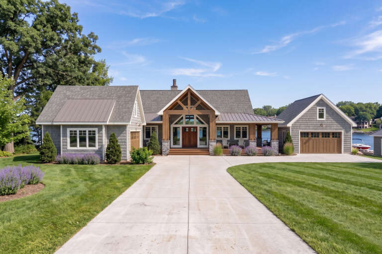 Grey Craftsman, Front Elevation, cedar accents, stone base, shingle siding, metal roof, concrete drive, lush landscaping. House Plan # 963-00465 Digital Rendering by America's Best House Plans, Inc.