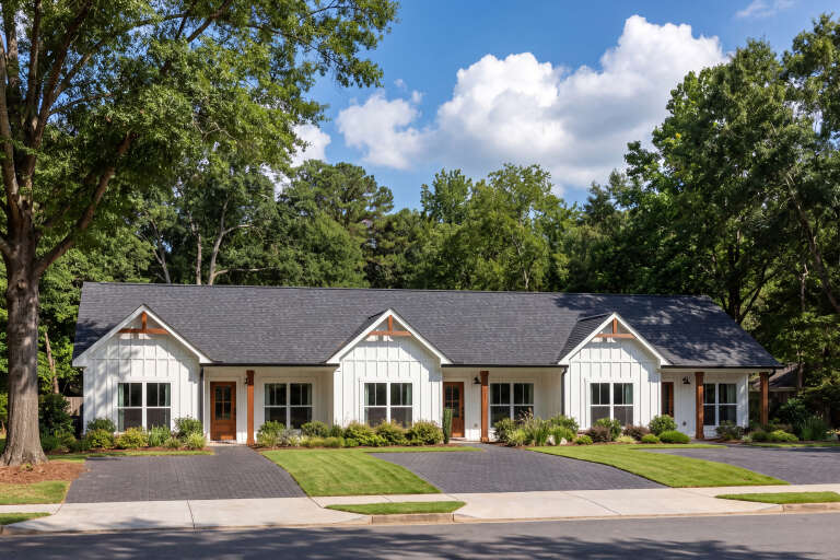 Front view of a white house in Modern Farmhouse style, board-and-batten siding, wood accents, and triple gabled roof. House Plan # 041-00396