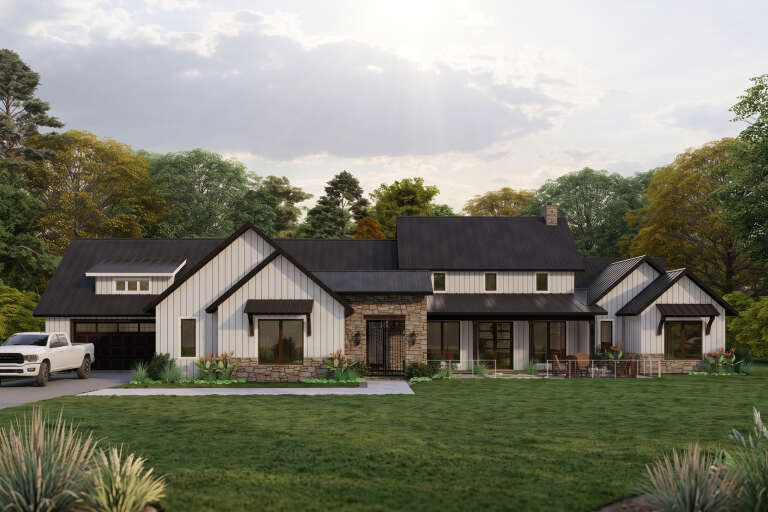 White Modern Farmhouse, Front Elevation with board-and-batten siding, stone accents, black metal roof, and patio seating. House Plan # 3822-00002 Digital Rendering by America's Best House Plans, Inc.