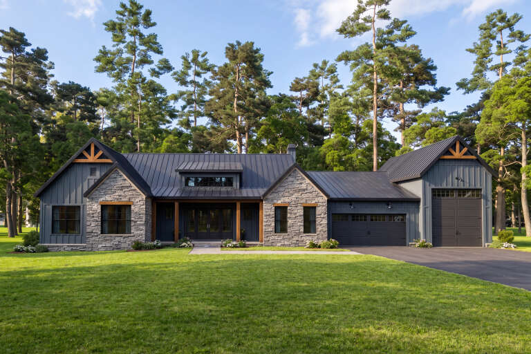 Grey Barndominium, Front Elevation, board-and-batten siding, stone veneer, metal roof, wood accents, and lush lawn. House Plan # 009-00531 Digital Rendering by America's Best House Plans, Inc.