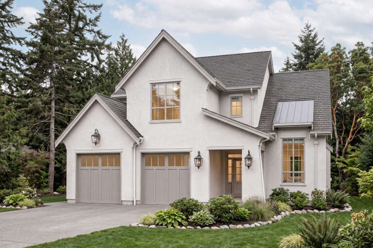 White European, Angled Front Elevation, stucco siding, grey garage doors, lantern sconces, metal roof accent, lush garden. House Plan # 8937-00130 Digital Rendering by America's Best House Plans, Inc.