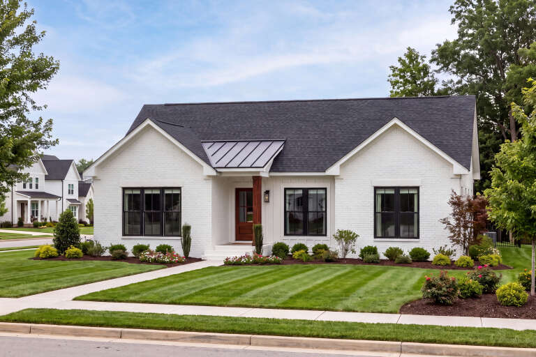 White Modern Farmhouse, Angled Front Elevation, painted brick, black roof, wood post, dark trim, and manicured landscape. House Plan # 041-00456 Digital Rendering by America's Best House Plans, Inc.