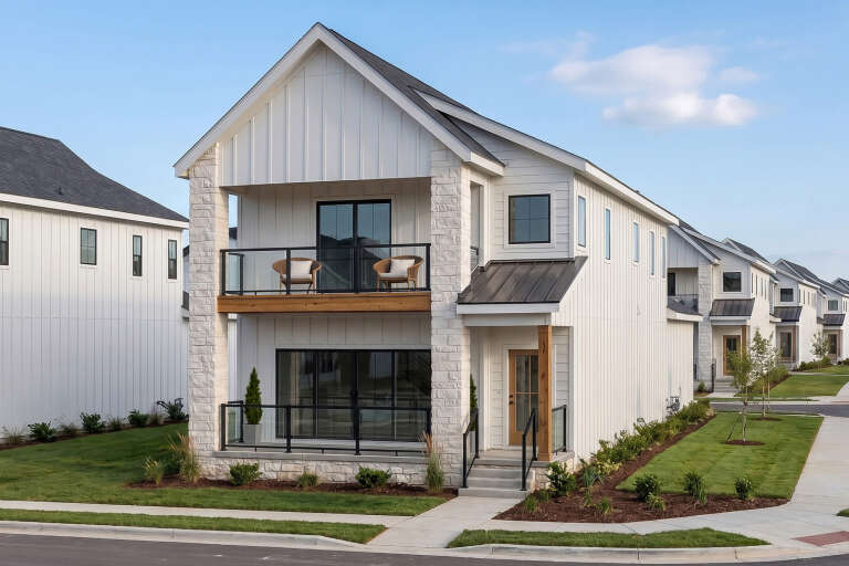 White Modern Farmhouse, Angled Front Elevation, board-and-batten siding, stone pillars, glass balconies, wood accents. House Plan # 963-01331 Digital Rendering by America's Best House Plans, Inc.