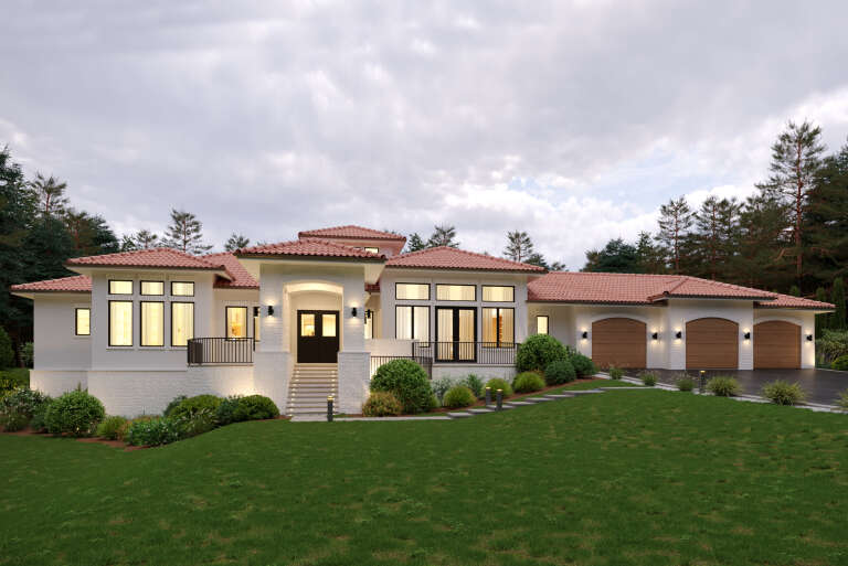 White Mediterranean, Front Elevation, stucco and stone siding, tile roof, arched garage doors, lit path, landscaping. House Plan # 5631-00354 Digital Rendering by America's Best House Plans, Inc.