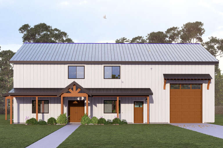 Front view of a white house in Barndominium style, metal roof, wood accents, covered porch, and large garage door. House Plan # 3822-00045
