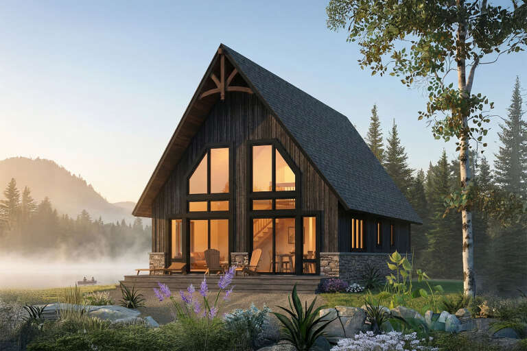 Angled front view of a black house in A-Frame style, stone base, floor-to-ceiling windows, and lakeside setting. House Plan # 034-01451
