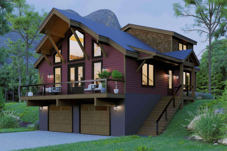 Angled front view of a red Craftsman house, metal roof, elevated deck, two-car garage, and mountain landscape. House Plan # 940-01493