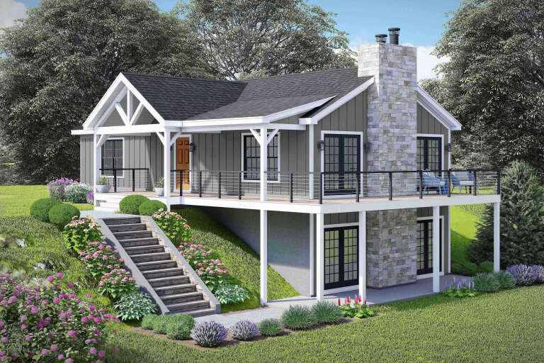 Angled front view of a grey Craftsman house, stone chimney, wrap-around deck, gabled roof, and landscaped hillside stairs. House Plan # 940-01496