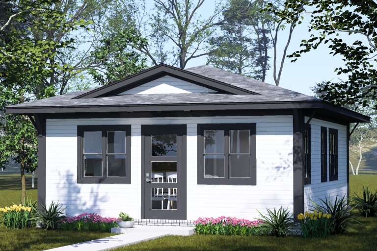 Front view of a white house in Cottage style, dark trim, gabled roof, multi-pane door, and flower bed landscaping. House Plan # 4848-00651
