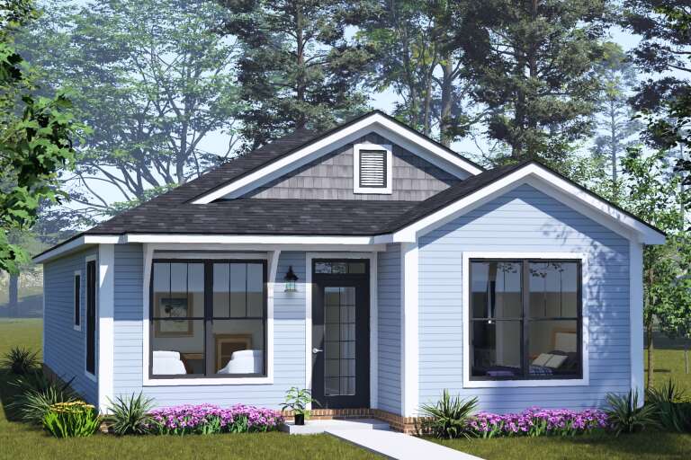 Front view of a light blue house in Cottage style, gray shake accents, dark trim, gabled roof, and flower landscaping. House Plan # 4848-00657