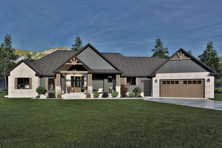 Front view of a grey Craftsman house, stone and vertical siding, timber accents, covered porch, and attached garage. House Plan # 7140-00045