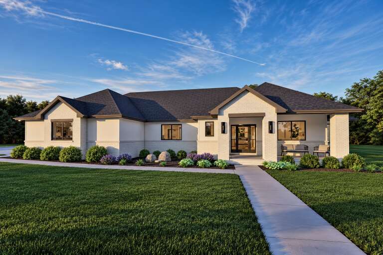 Front view of a white house in Contemporary style, brick accents, dark roof, covered porch, and manicured landscaping. House Plan # 7140-00055