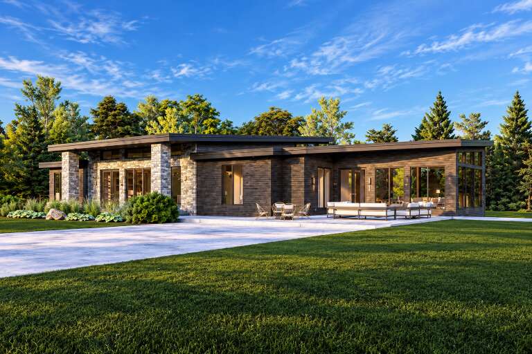 Angled rear view of a dark wood Contemporary house, stone accents, flat roof, large windows, and patio furniture. House Plan # 7140-00056