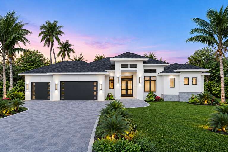 Front view of a white house in Contemporary style, dark roof, black garage doors, modern lighting, and palm landscaping. House Plan # 5565-00192