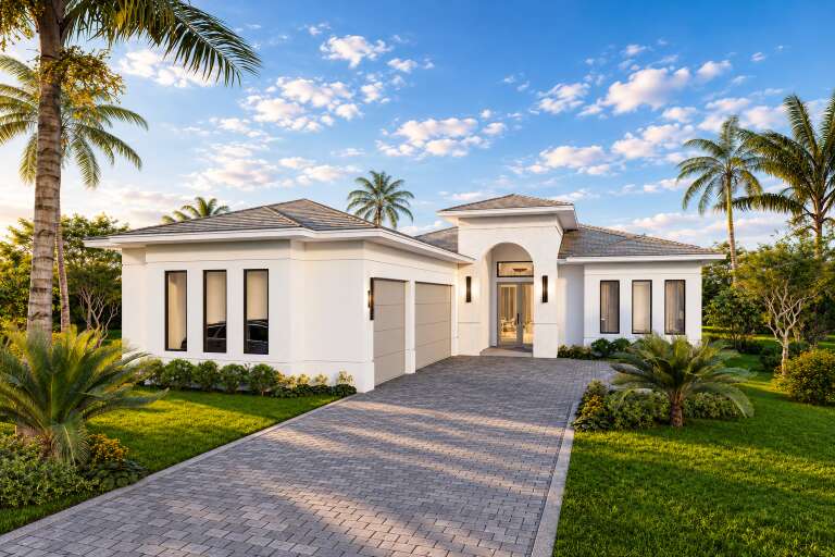 Angled front view of a white house in Contemporary style, arched entryway, hip roof, and tropical landscaping. House Plan # 5565-00194