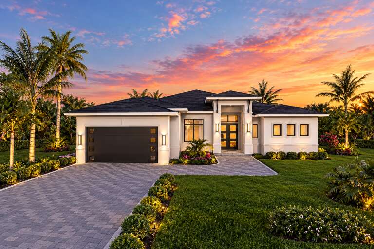 Front view of a white house in Contemporary style, dark garage door, hip roof, palm trees, and illuminated entry. House Plan # 5565-00195